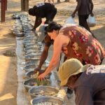 Mrs Brown getting involved in the feeding for the dogs