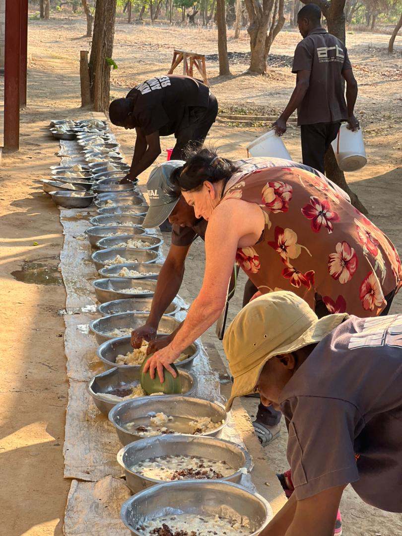 Mrs Brown getting involved in the feeding for the dogs